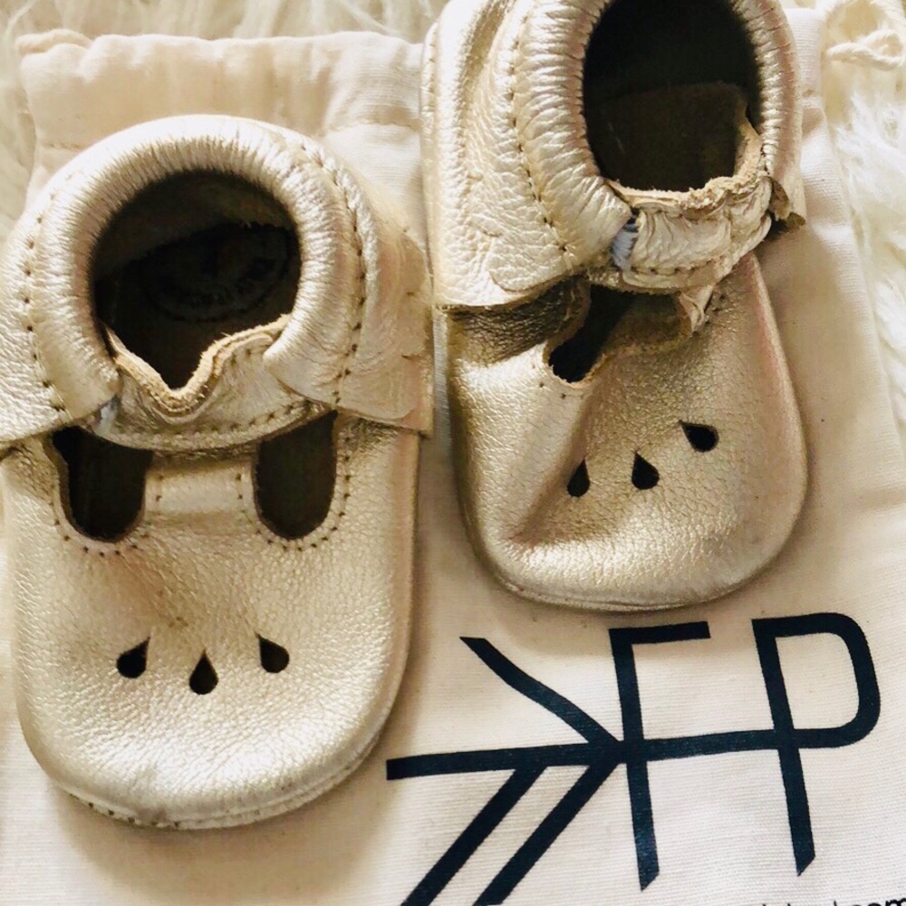Freshly Picked platinum Mary Jane moccasins.